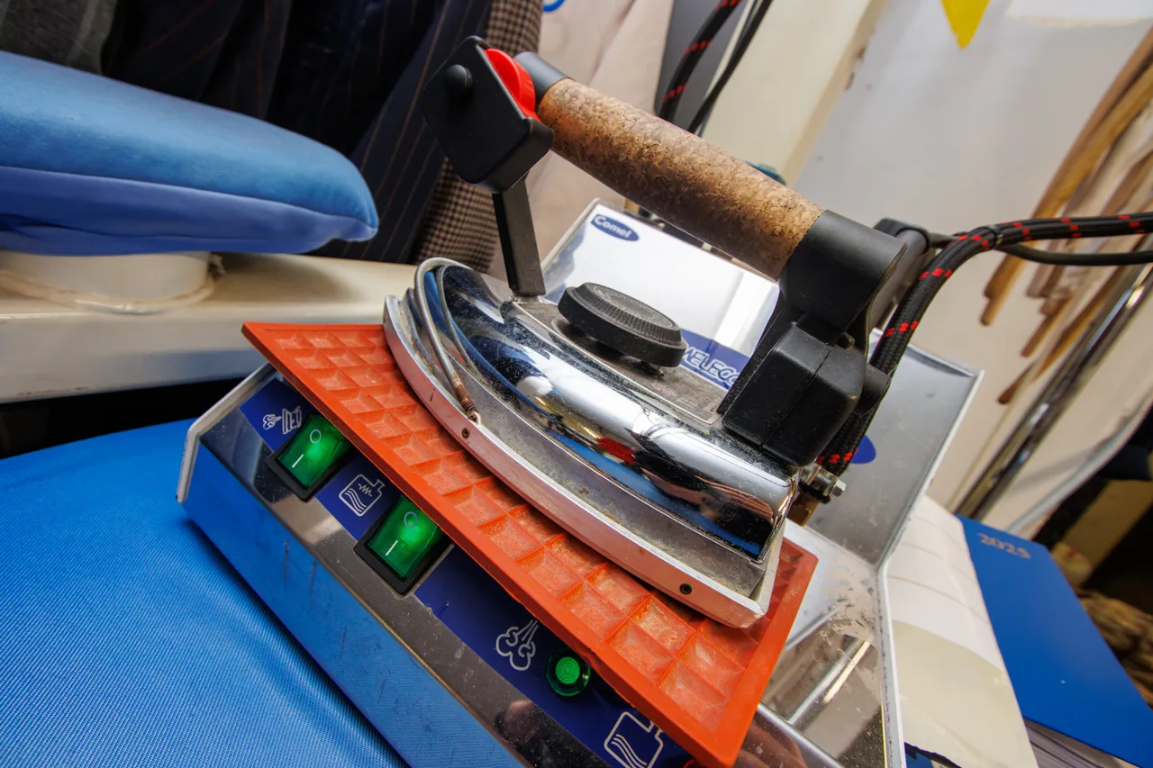 Professional steam iron in use